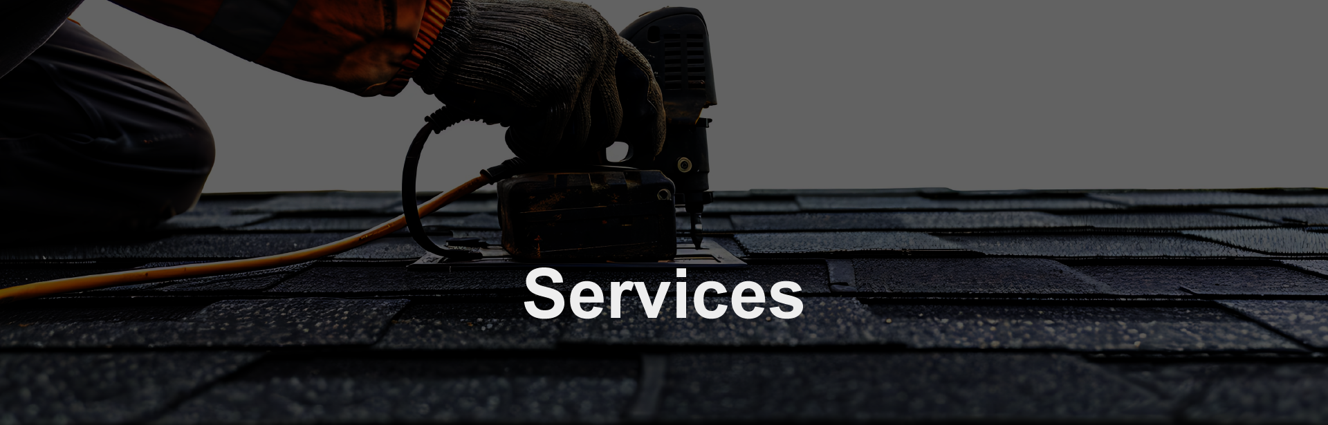 Services - A worker installing shingles on the roof.